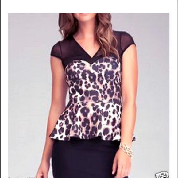 Tops - Super flattering Bebe peplum top with mesh top